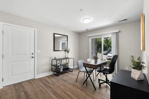 South Lyon apartment for rent - a living room and dining room with a table and chairs and a window