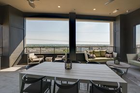 Dallas apartment for rent - A modern dining room with a table set for six.