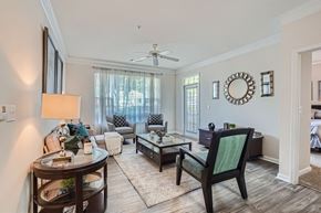 Doraville apartment for rent - A living room with a dark wood floor and furniture.