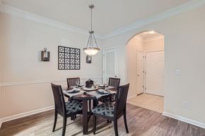 Doraville apartment for rent - A dining room with a table set for four.