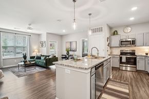 Lebanon apartment for rent - A modern kitchen with a large island and stainless steel appliances.