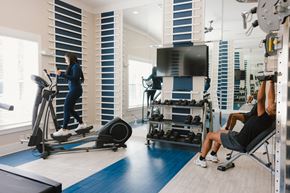 Columbia apartment for rent - a woman exercising in a gym with a trainer