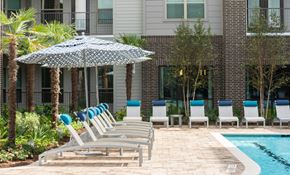 The Woodlands apartment for rent - row of benches to catch sun rays