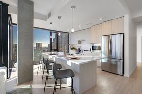 San Diego apartment for rent - A modern kitchen with a dining table and chairs.