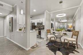 Grapevine apartment for rent - a dining room and kitchen area with a table and chairs