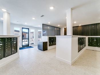 Interior mail center with access controlled package room