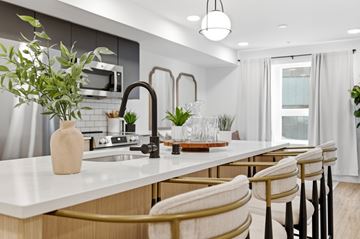 Jackson apartment for rent - A kitchen with a white countertop and a sink with a brown faucet.