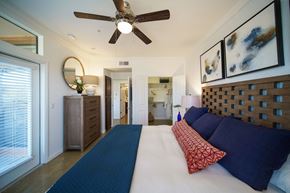 Georgetown apartment for rent - a bedroom with a large bed and a ceiling fan
