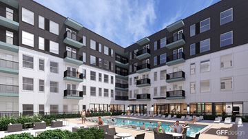 Austin apartment for rent - A large outdoor pool area with people relaxing and enjoying the sun.