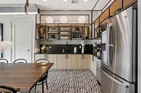 Franklin apartment for rent - A modern kitchen with a wooden table and stainless steel appliances.