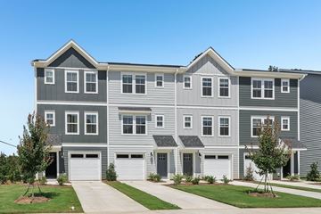 Charlotte townhouse for rent - A grey and white townhouse with a garage door.
