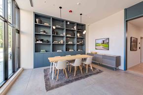 Durham apartment for rent - A modern dining room with a wooden table and chairs.