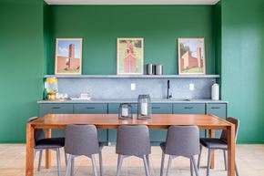 Durham apartment for rent - a dining room with green walls and a table with chairs