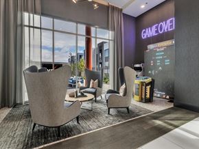 Las Vegas apartment for rent - A modern lounge area with a large screen displaying the words