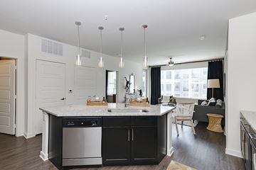 Covington apartment for rent - a kitchen with an island and a living room with a couch