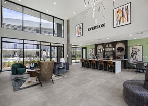 Katy apartment for rent - the lobby of a building with a bar and chairs