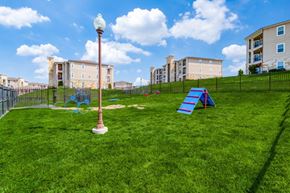 Denison apartment for rent - a playground on the grass with apartments in the background