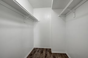 Dallas apartment for rent - an empty room with white walls and a wooden floor