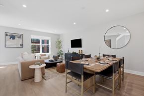 Skokie townhouse for rent - A modern dining room with a wooden table and chairs.