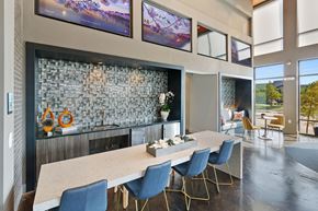 Richardson apartment for rent - a dining room with a long table and chairs and a fireplace