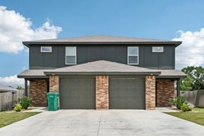Harker Heights townhouse for rent - A house with a grey roof and a garage door.