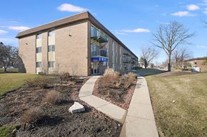 Roselle apartment for rent - a brick building with a sidewalk in front of it