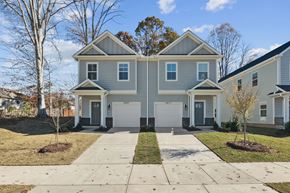 Charlotte townhouse for rent - A two-story house with a grey and white exterior.