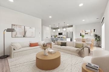 Naperville apartment for rent - A modern living room with a white sofa, a wooden coffee table, and a large painting on the wall.