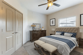Pasadena apartment for rent - A bedroom with a bed, dresser, and a ceiling fan.