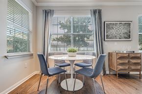 Katy apartment for rent - A dining room with a table and chairs.