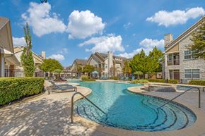 Katy apartment for rent - A swimming pool surrounded by a residential area.