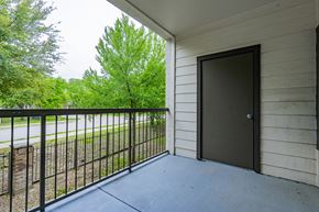 Garland apartment for rent - the balcony of a building with a door to a patio