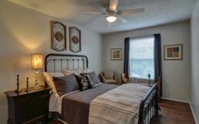 San Antonio apartment for rent - a bedroom with a bed and a ceiling fan