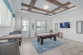 Fort Myers apartment for rent - a game room with a pool table and a bar