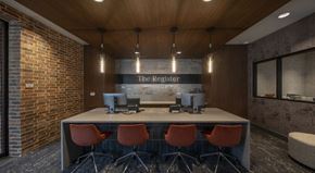 Richardson apartment for rent - A conference room with a long table and chairs, a computer, and a sign that reads "The Register.".