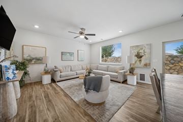 El Paso apartment for rent - A living room with a grey sofa set and a wooden floor.