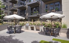 Charlotte apartment for rent - a patio with tables and chairs and umbrellas