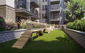 Charlotte apartment for rent - a seating area in a garden in front of an apartment building
