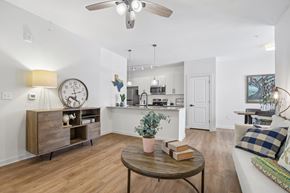 Leander apartment for rent - A living room with a wooden floor and a ceiling fan.