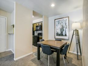 Houston apartment for rent - a dining room with a table and chairs and a tripod