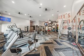 Brighton apartment for rent - a gym with weights and other exercise equipments and a sign that reads left s