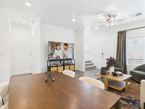 Las Vegas townhouse for rent - A modern dining room with a wooden table and chairs.