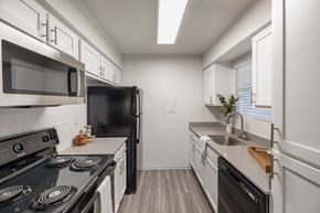 Houston apartment for rent - the preserve at ballantyne commons apartment kitchen with stove refrigerator and sink