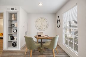 Houston apartment for rent - a dining room with a large clock on the wall
