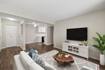 Auburn apartment for rent - A living room with a white couch and a wooden coffee table.