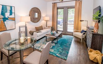 Plank flooring in living and dining areas
