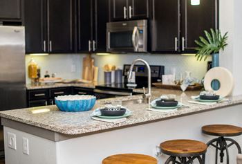 Hardwood 42in kitchen cabinetry and granite countertops