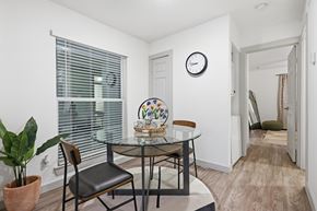 Fort Worth apartment for rent - A dining room with a glass table and chairs.