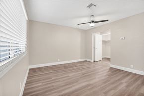 Las Vegas apartment for rent - a bedroom with hardwood floors and a ceiling fan