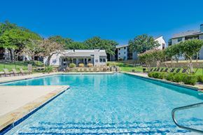 Arlington apartment for rent - a swimming pool with a house in the background